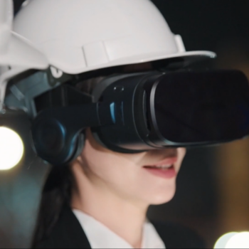 Woman smiling with VR headset on and enjoying the benefits of VR Training