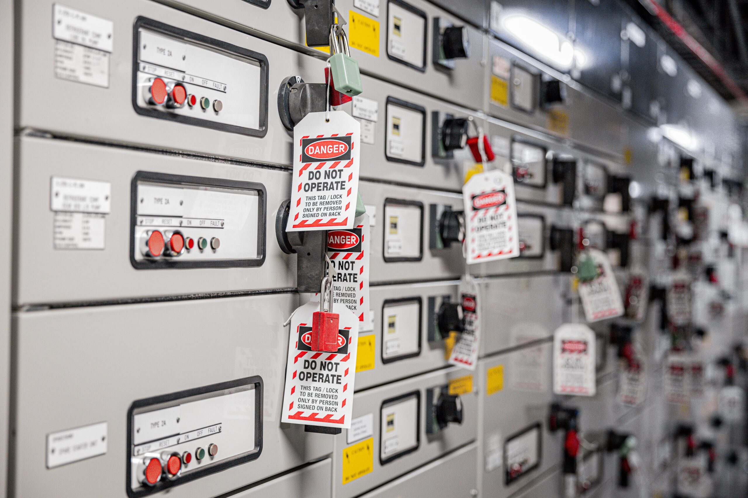 Lockout tagout devices on electric control panel