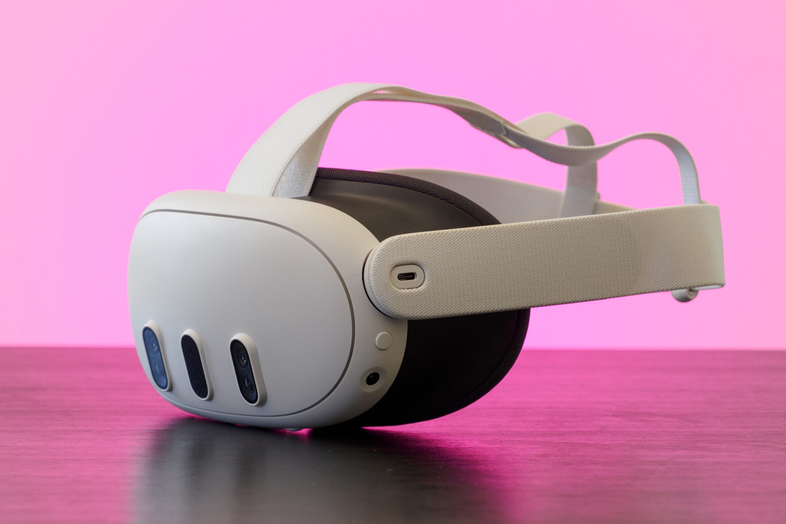 Meta quest 3 AR/VR headset with pink lighting 